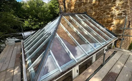 A glass lantern roof, with leadwork to the ridge and hips.
