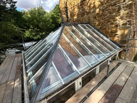 A glass lantern roof, with leadwork to the ridge and hips.