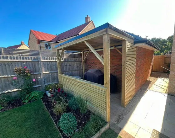 A timber framed enclosure built in a new-build garden.